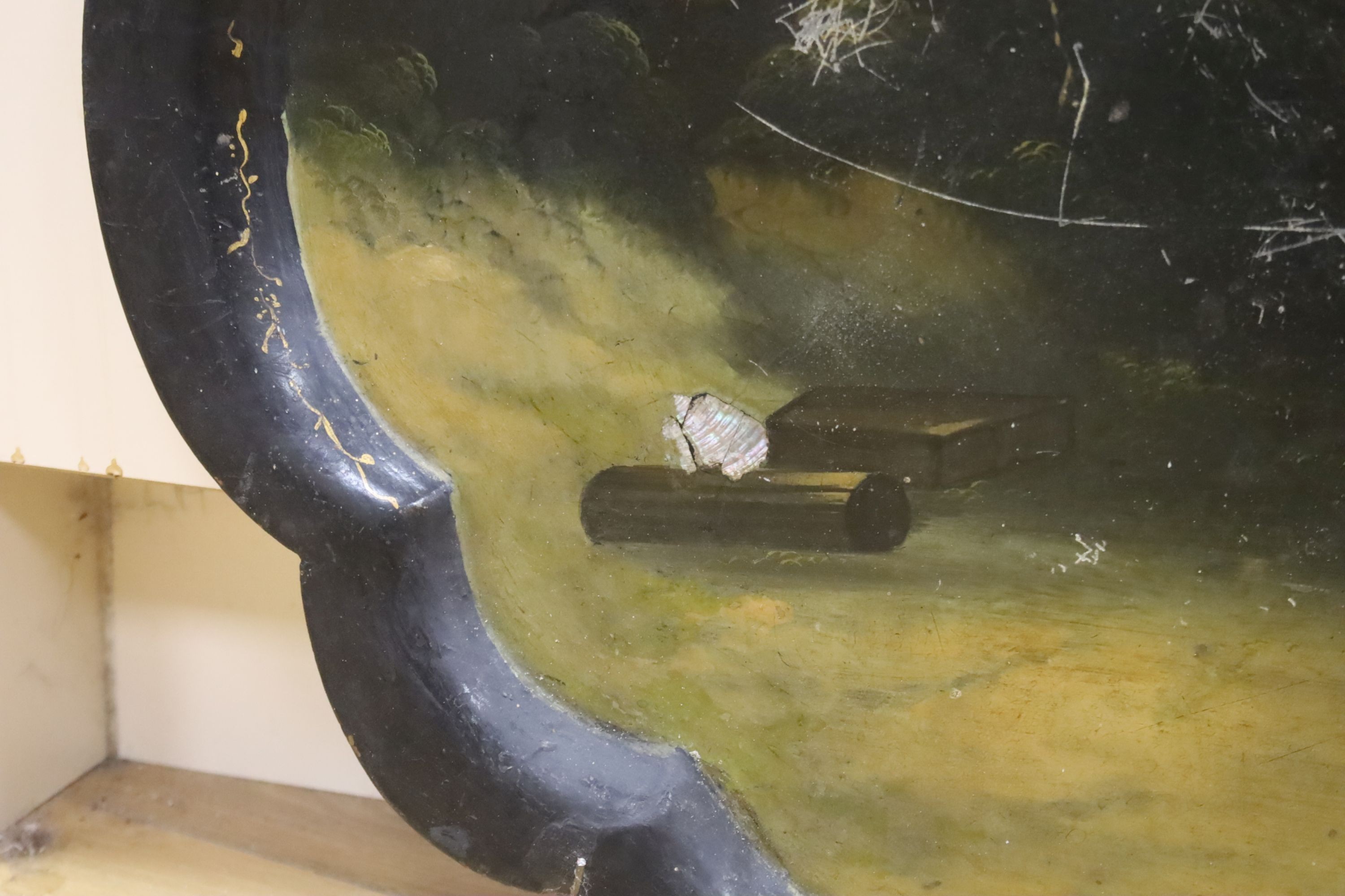A Victorian papier mache tray, painted with Orientalist figures amongst ruins, 75cm (a.f.)